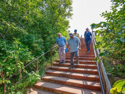 Friends board members and NPS Director Chuck Sams walk Meyers Beach stairs - NPS photo