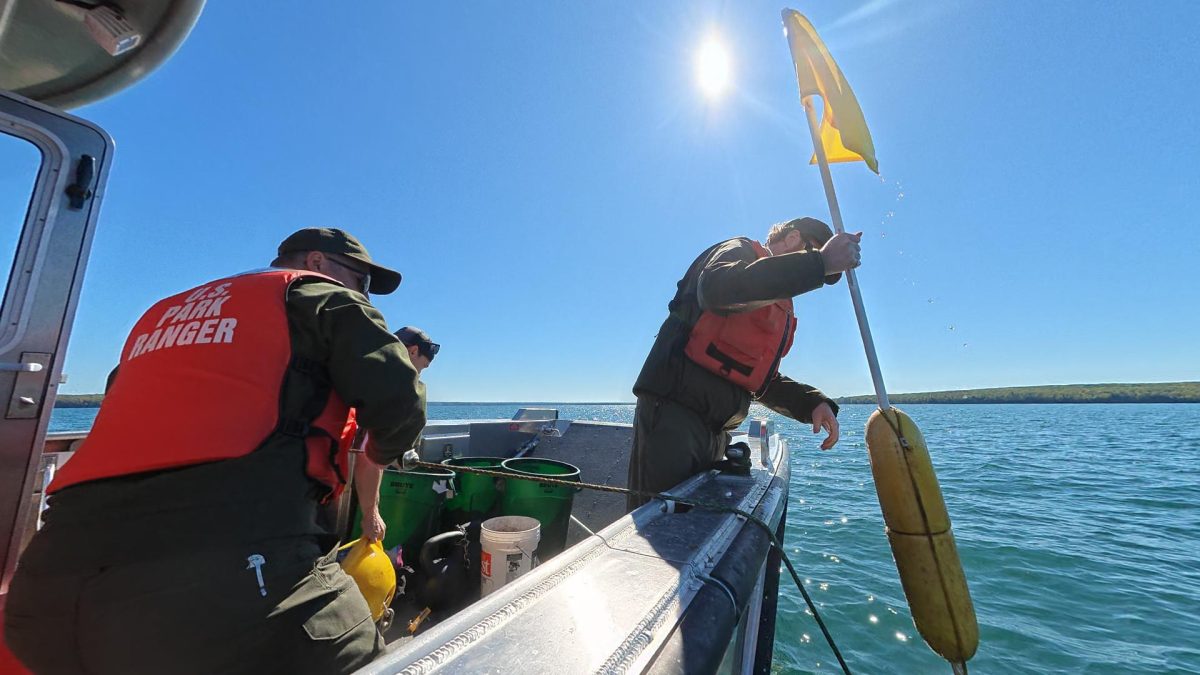 Max Zeitler brings one of the yellow flags on board - Jon Okerstrom photo