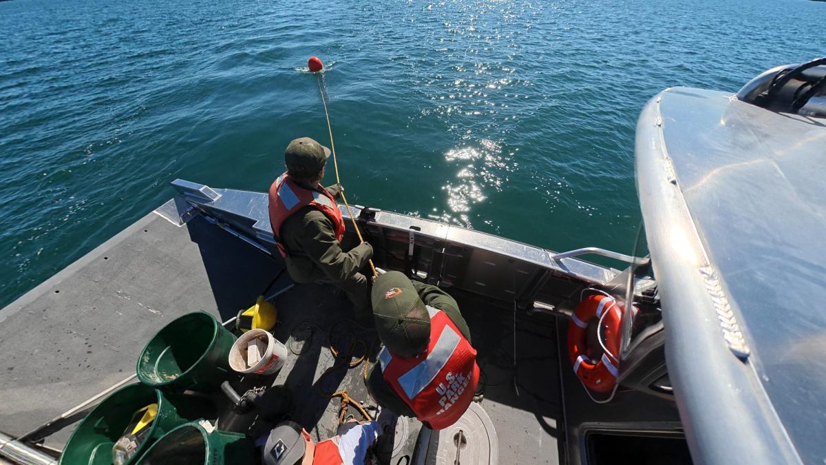 High view of team pulling in the lifter buoy on the anchor line - Jon Okerstrom photo